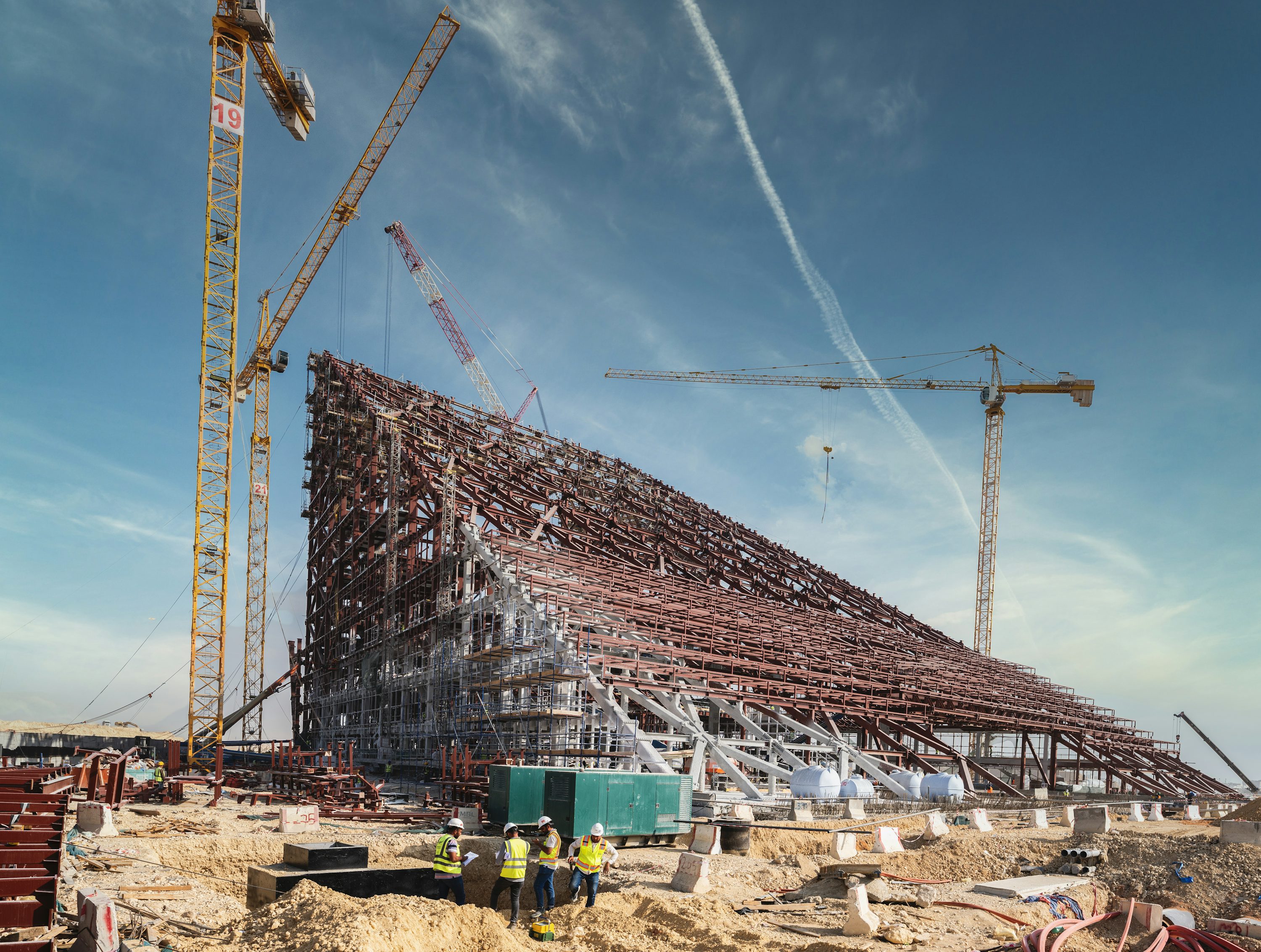 Cranes and steel framework at a construction site in Riyadh, Saudi Arabia